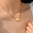 Load image into Gallery viewer, A model wearing 666 angel number pendant gold necklace
