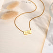 Load image into Gallery viewer, 666 angel number pendant gold necklace laid out