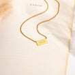 Load image into Gallery viewer, 999 angel number pendant gold necklace laid out