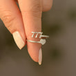 Load image into Gallery viewer, A model holding a 777 Angel Number Silver ring