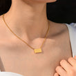 Load image into Gallery viewer, A model wearing a 222 angel number pendant gold necklace
