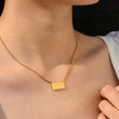 Load image into Gallery viewer, A model wearing 777 angel number pendant gold necklace
