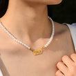 Load image into Gallery viewer, Model wearing a 000 angel number pearl gold necklace