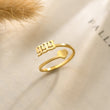 Load image into Gallery viewer, 999 Angel number Silver ring placed on top of a piece of paper