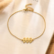 Load image into Gallery viewer, 999 Angel number gold anklet placed on top of a piece of paper