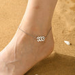 Load image into Gallery viewer, A model wearing a 333 Angel Number Silver-plated Anklet