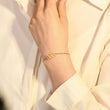 Load image into Gallery viewer, A model wearing an Angel Number 333 bracelet on her left wrist