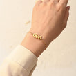 Load image into Gallery viewer, A model wearing an Angel Number 666 bracelet on her left wrist