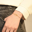 Load image into Gallery viewer, A model wearing an angel number 777 bracelet