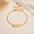 Load image into Gallery viewer, Angel Number 222 gold bracelet on a canvas background