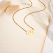 Load image into Gallery viewer, 222 angel number pendant gold necklace laid out