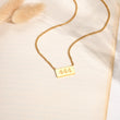 Load image into Gallery viewer, 444 angel number pendant gold necklace laid out
